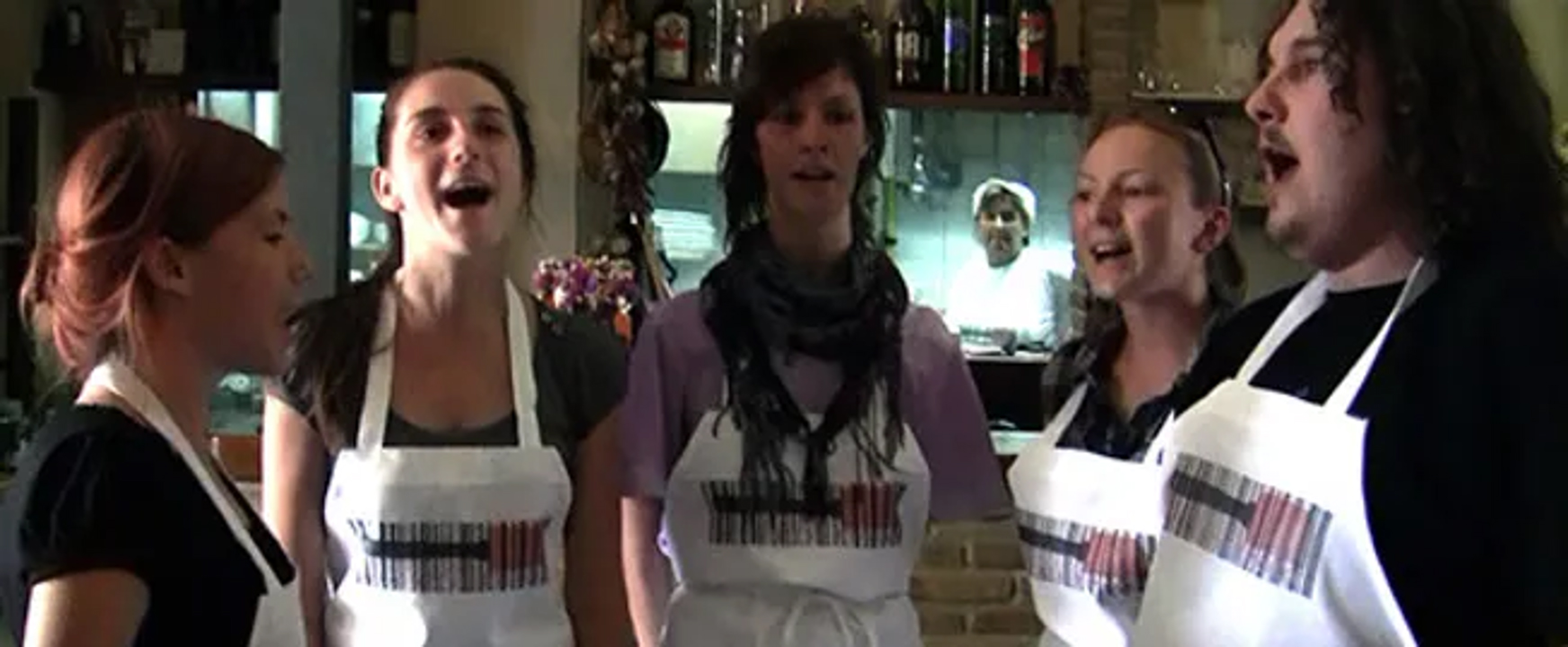 a capella singers in logo aprons