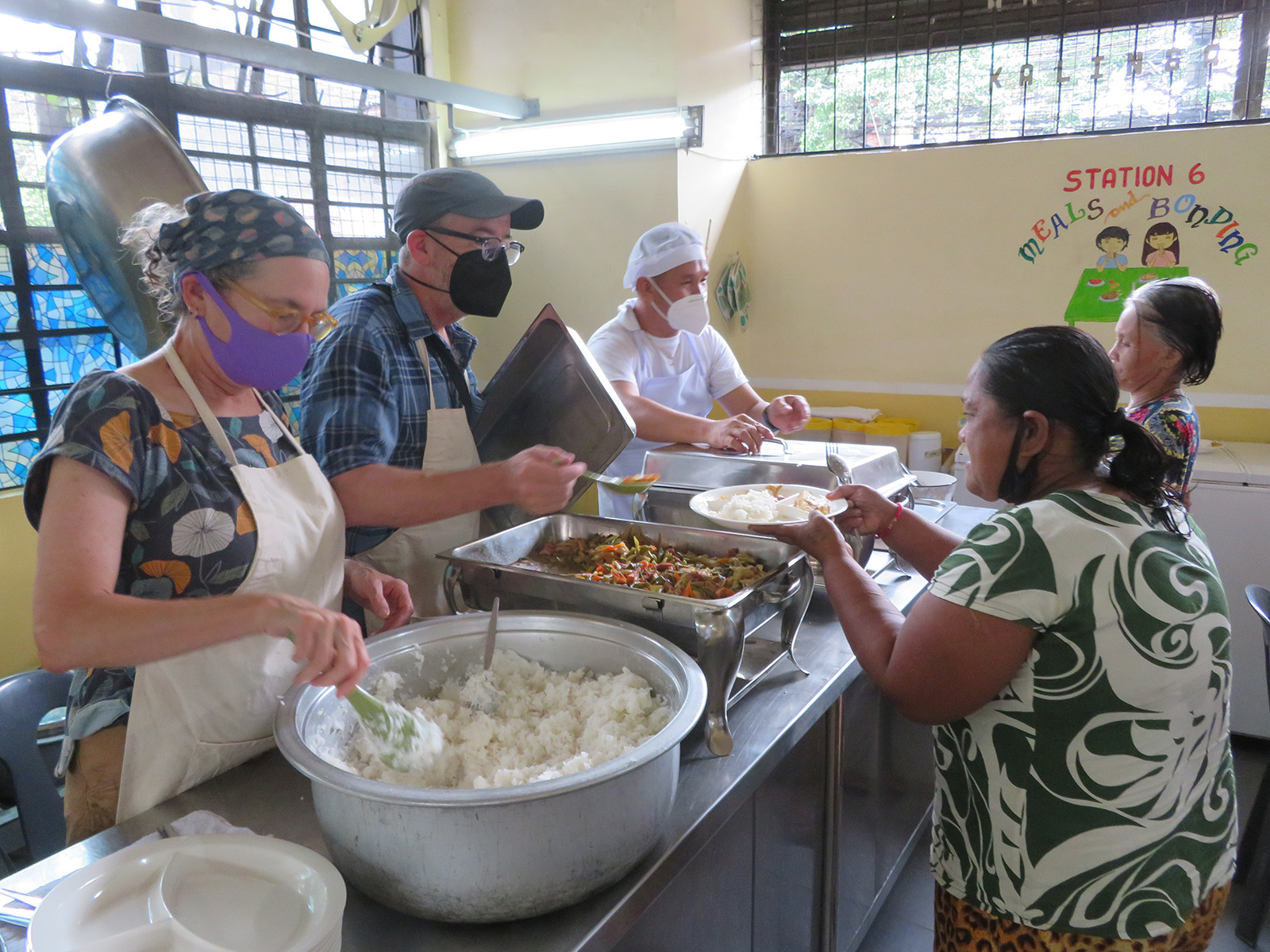 Clark and Peterson serving food