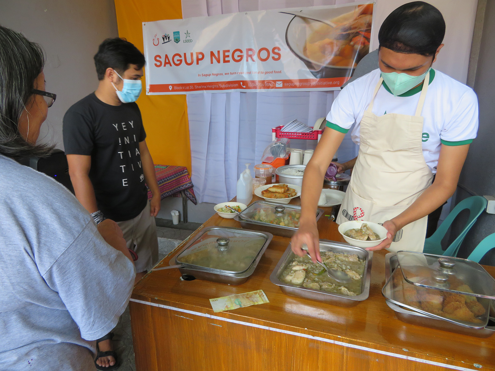 Sagup Negros banner above covered serving dishes